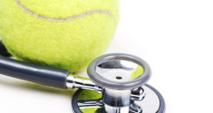 25226706 - stethoscope and tennis ball on isolate